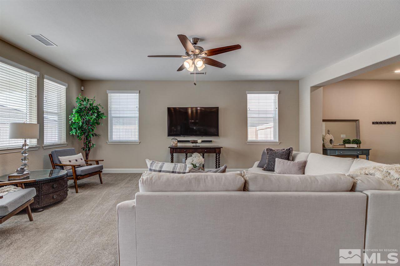 10290 Culiacan Pass Trail Reno, NV 89521 - Photo 5 of 23 a living room with furniture and a flat screen tv