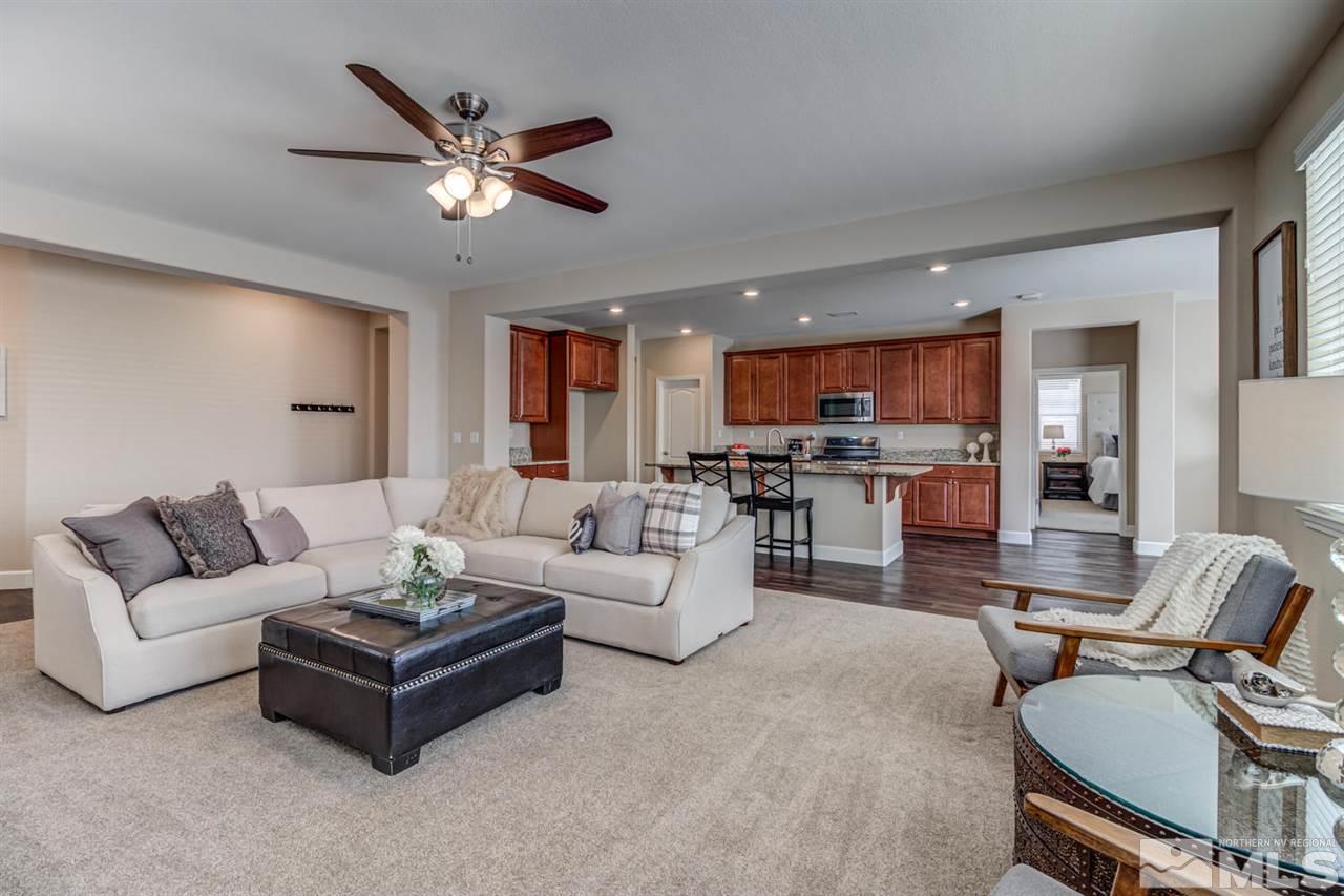 10290 Culiacan Pass Trail Reno, NV 89521 - Photo 6 of 23 a living room with furniture kitchen view and a chandelier