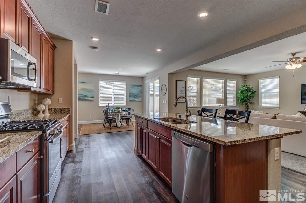 10290 Culiacan Pass Trail Reno, NV 89521 - Photo 9 of 23 a kitchen with sink stove and cabinets