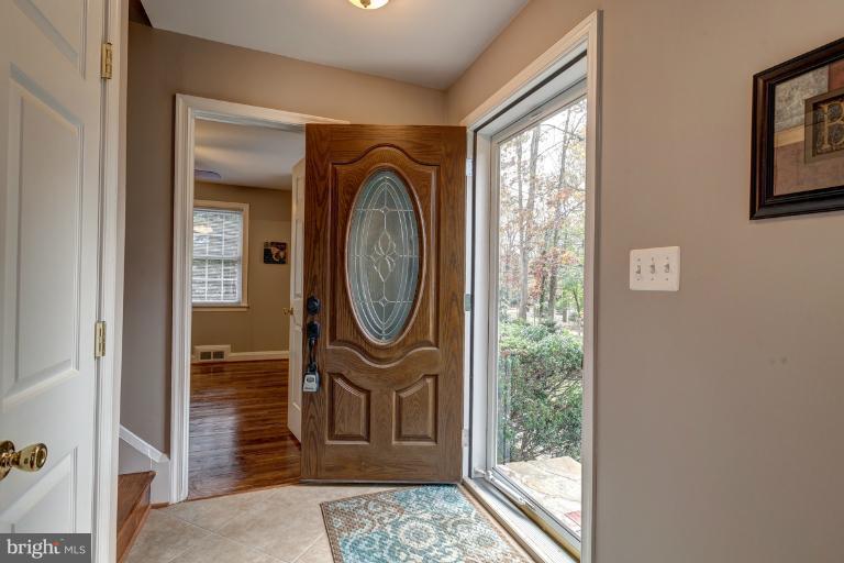 1010 Hart Road Baltimore, MD 21286 - Photo 13 of 30 a view of a hallway with wooden floor and windows