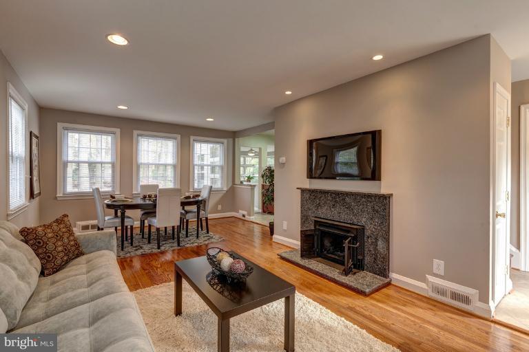 1010 Hart Road Baltimore, MD 21286 - Photo 18 of 30 a living room with furniture a flat screen tv and a fireplace