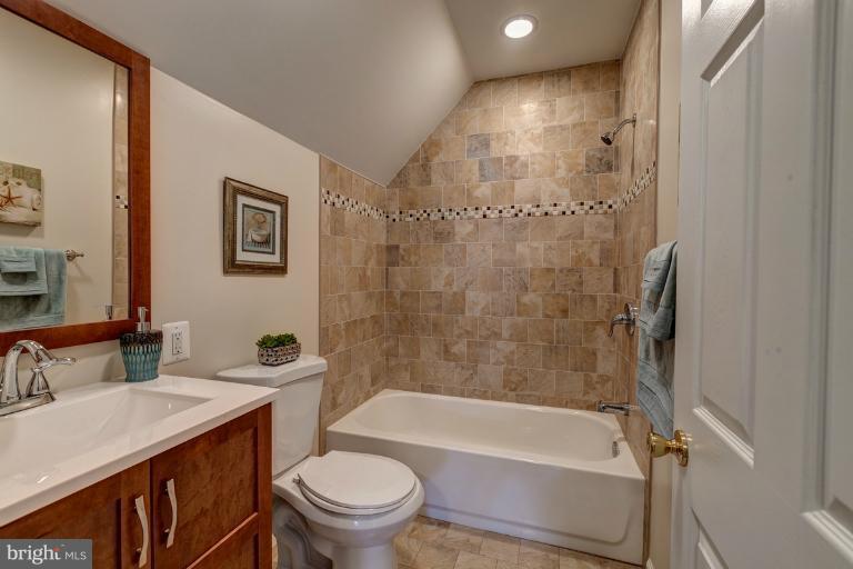 1010 Hart Road Baltimore, MD 21286 - Photo 19 of 30 a bathroom with a sink toilet and shower