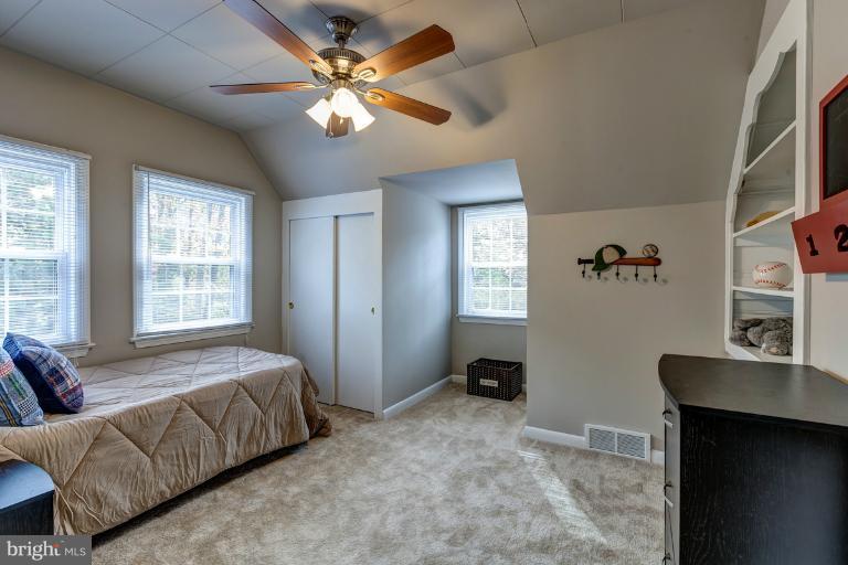 1010 Hart Road Baltimore, MD 21286 - Photo 24 of 30 a bedroom with a bed dresser and a window