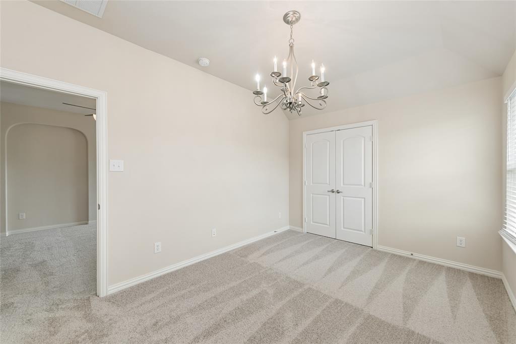 12571 Valley Spring Drive Frisco, TX 75035 - Photo 28 of 39 en empty room with windows