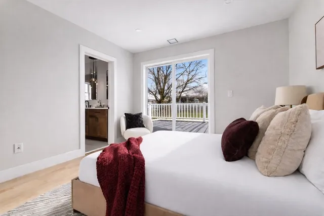 a bedroom with a bed and a chair