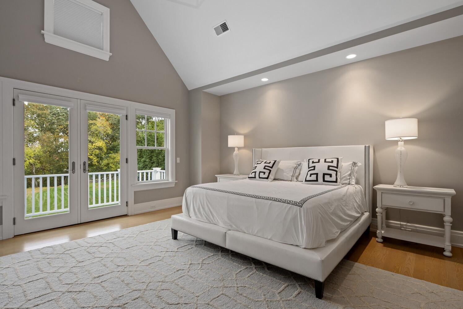 35 Prospect Road Westport, CT 06880 - Photo 22 of 40 a spacious bedroom with a bed and a large window