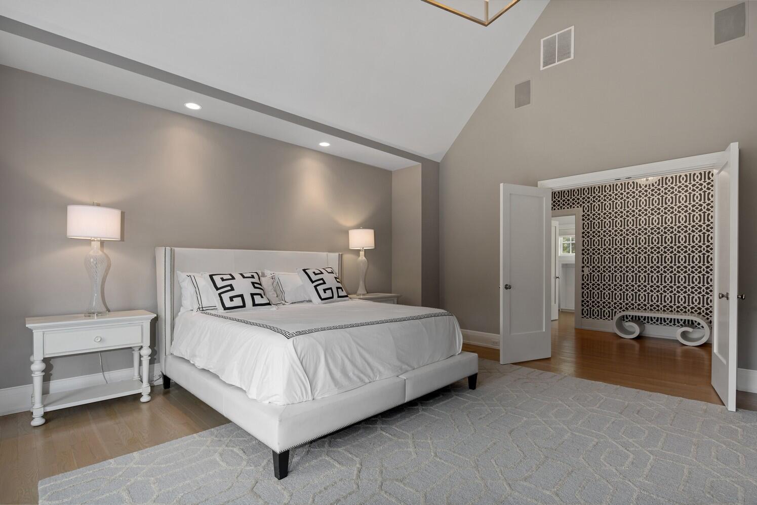 35 Prospect Road Westport, CT 06880 - Photo 23 of 40 a bedroom with a bed and a lamp on table