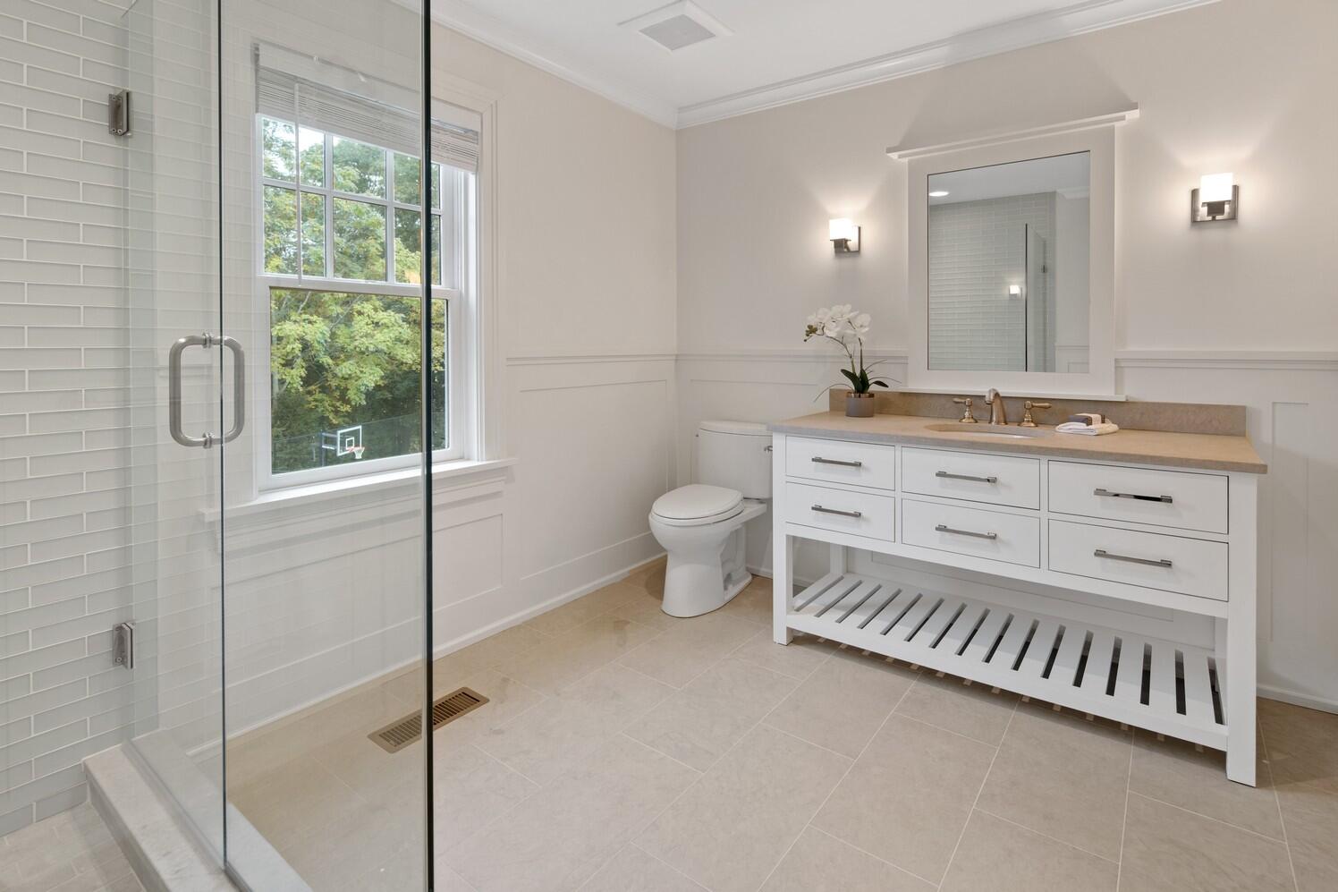 35 Prospect Road Westport, CT 06880 - Photo 31 of 40 a bathroom with a granite countertop sink a toilet and a mirror