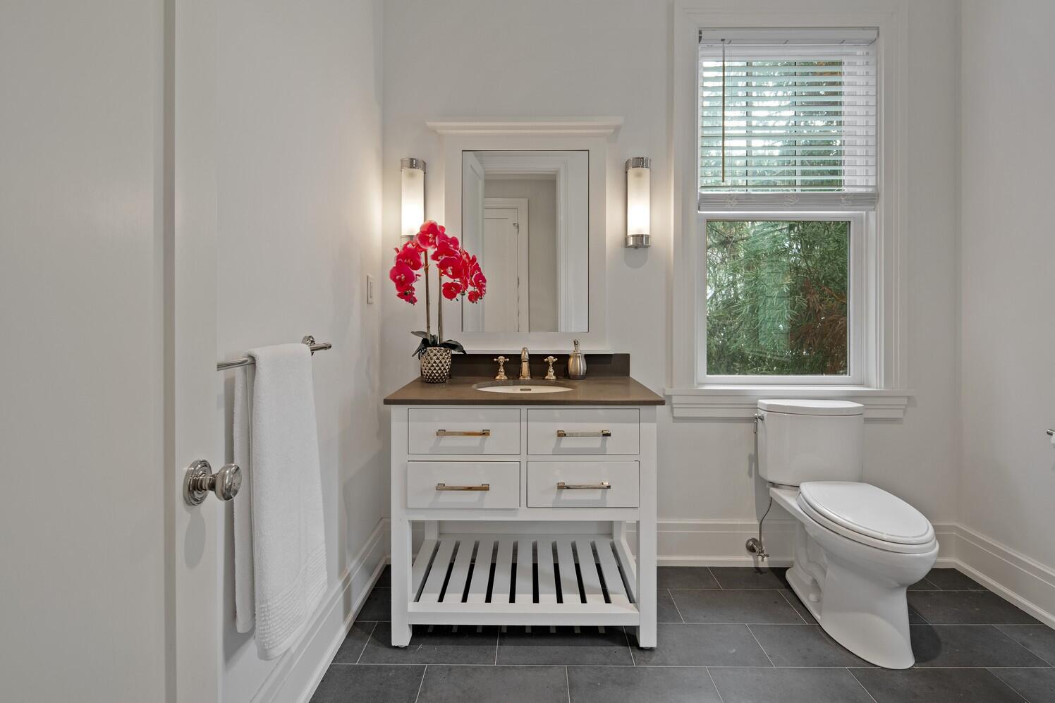 35 Prospect Road Westport, CT 06880 - Photo 33 of 40 a bathroom with a sink mirror and a window