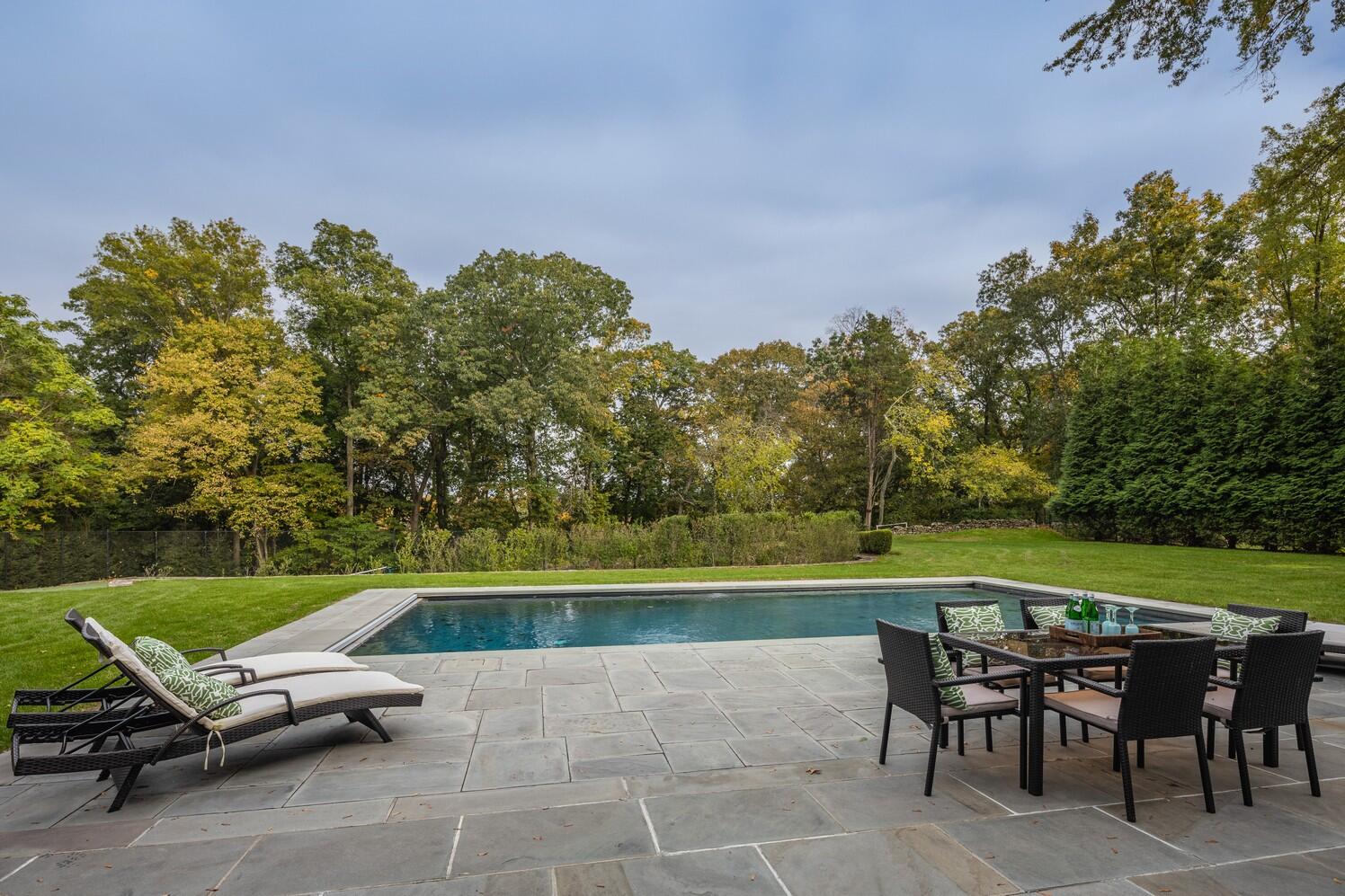 35 Prospect Road Westport, CT 06880 - Photo 38 of 40 an outdoor sitting area with couch and umbrella