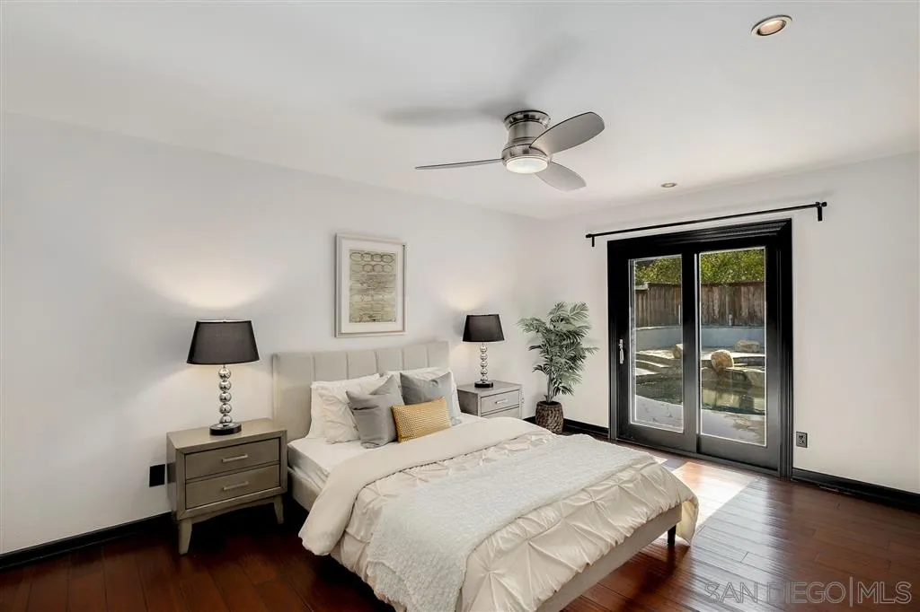 2033 Village Wood Road Encinitas, CA 92024 - Photo 18 of 25 a bedroom with a bed and wooden floor