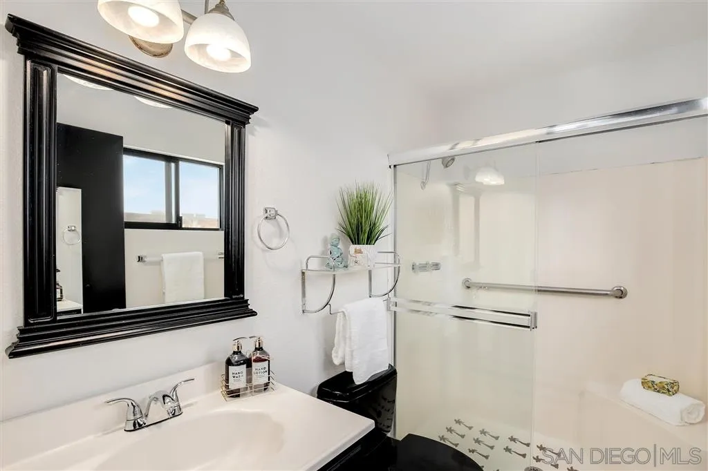 2033 Village Wood Road Encinitas, CA 92024 - Photo 19 of 25 a bathroom with a sink and a mirror
