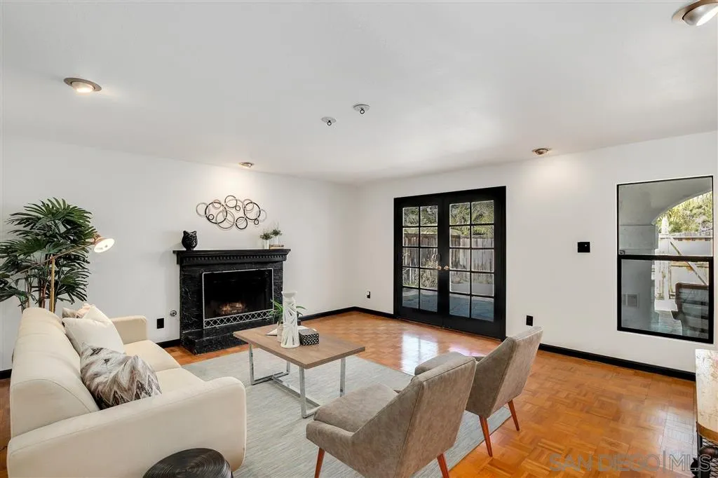 2033 Village Wood Road Encinitas, CA 92024 - Photo 3 of 25 a living room with furniture and a fireplace
