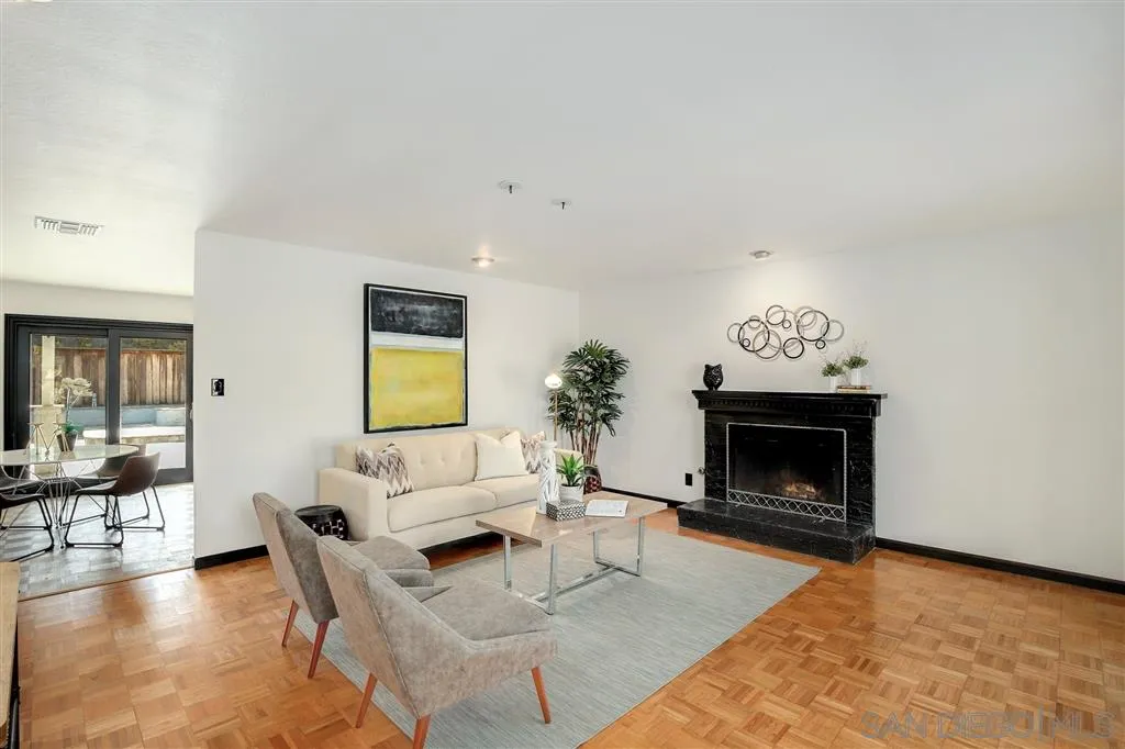 2033 Village Wood Road Encinitas, CA 92024 - Photo 4 of 25 a living room with furniture and a fireplace