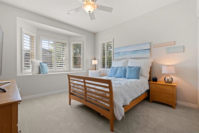 a bed room with a bed and a chandelier