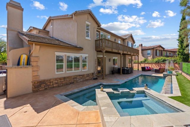 a front view of a house with swimming pool