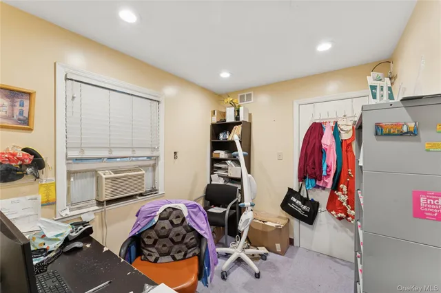 a bedroom with bed and a window