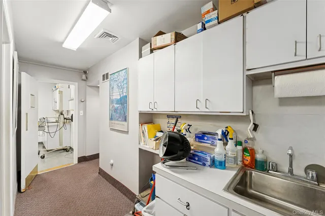 a room with furniture a rug and a window