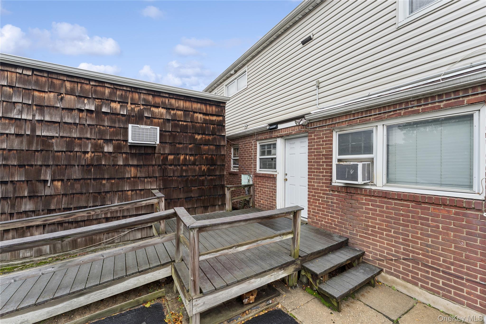 5 Seaton Gate Valley Stream, NY 11580 - Photo 33 of 36 a view of an outdoor space with seating area