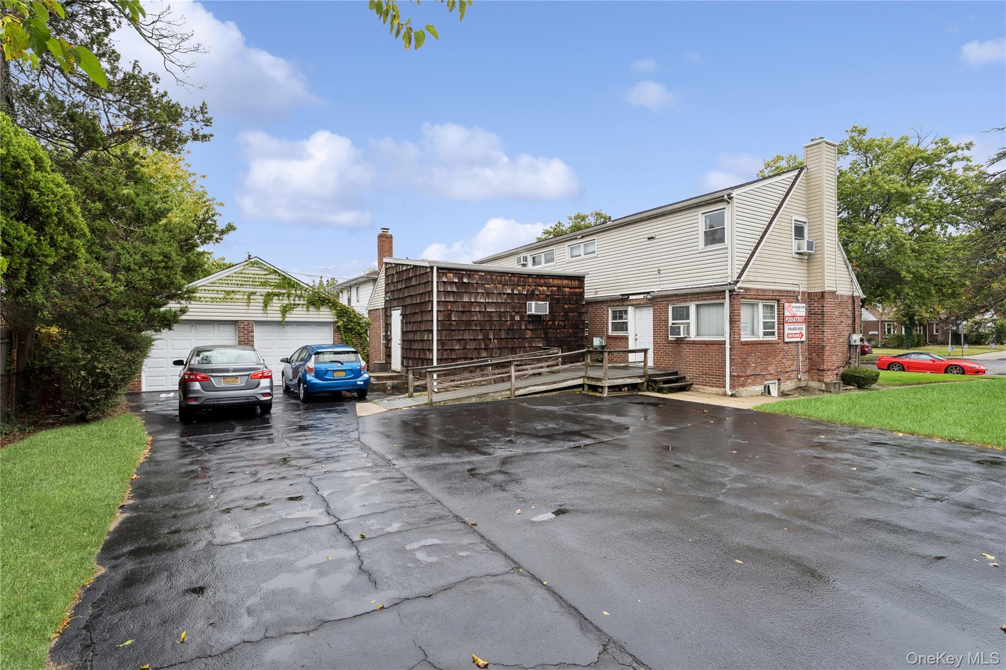 5 Seaton Gate Valley Stream, NY 11580 - Photo 35 of 36 a view of a car park in front of house