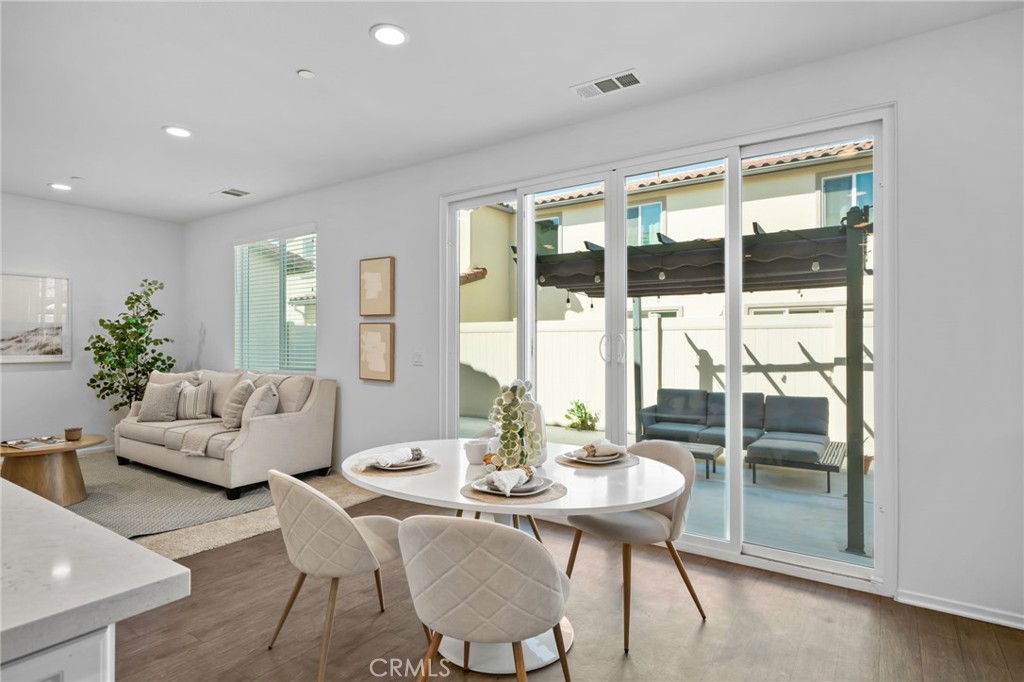 24085 Midvale Court Corona, CA 92883 - Photo 11 of 56 a living room with furniture and a large window