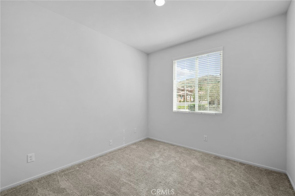 24085 Midvale Court Corona, CA 92883 - Photo 13 of 56 an empty room with a window