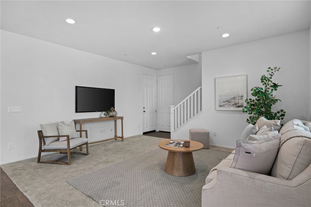 24085 Midvale Court Corona, CA 92883 - Photo 17 of 56 a living room with furniture and a flat screen tv