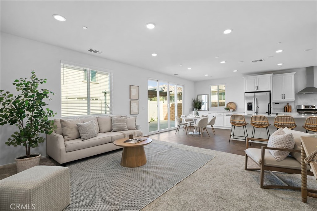 24085 Midvale Court Corona, CA 92883 - Photo 18 of 56 a living room with furniture and a large window
