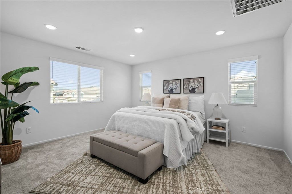 24085 Midvale Court Corona, CA 92883 - Photo 19 of 56 a bedroom with a bed and a window