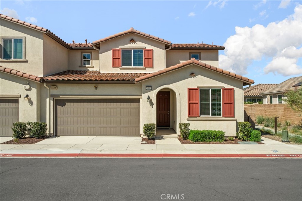 24085 Midvale Court Corona, CA 92883 - Photo 2 of 56 a front view of a house with a yard