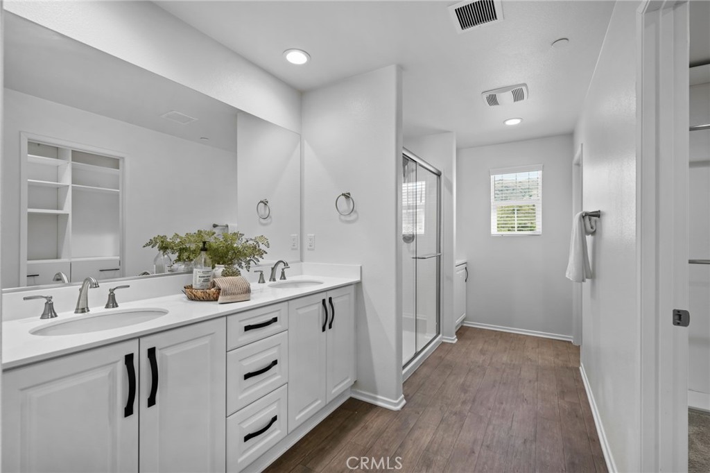 24085 Midvale Court Corona, CA 92883 - Photo 22 of 56 a bathroom with a sink and a mirror