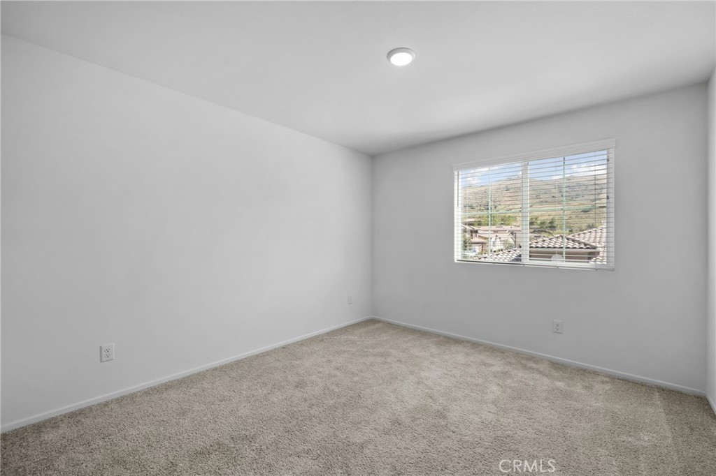 24085 Midvale Court Corona, CA 92883 - Photo 28 of 56 an empty room with windows