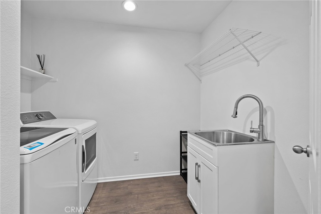 24085 Midvale Court Corona, CA 92883 - Photo 32 of 56 a kitchen with a sink and a stove top oven