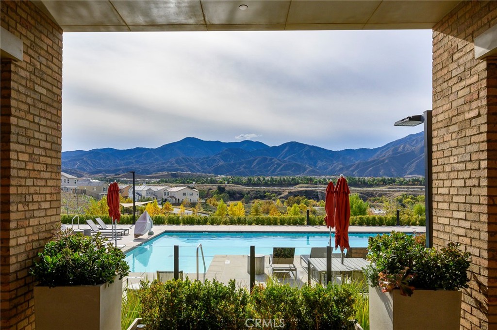 24085 Midvale Court Corona, CA 92883 - Photo 50 of 56 a view of a house with a yard and a fountain
