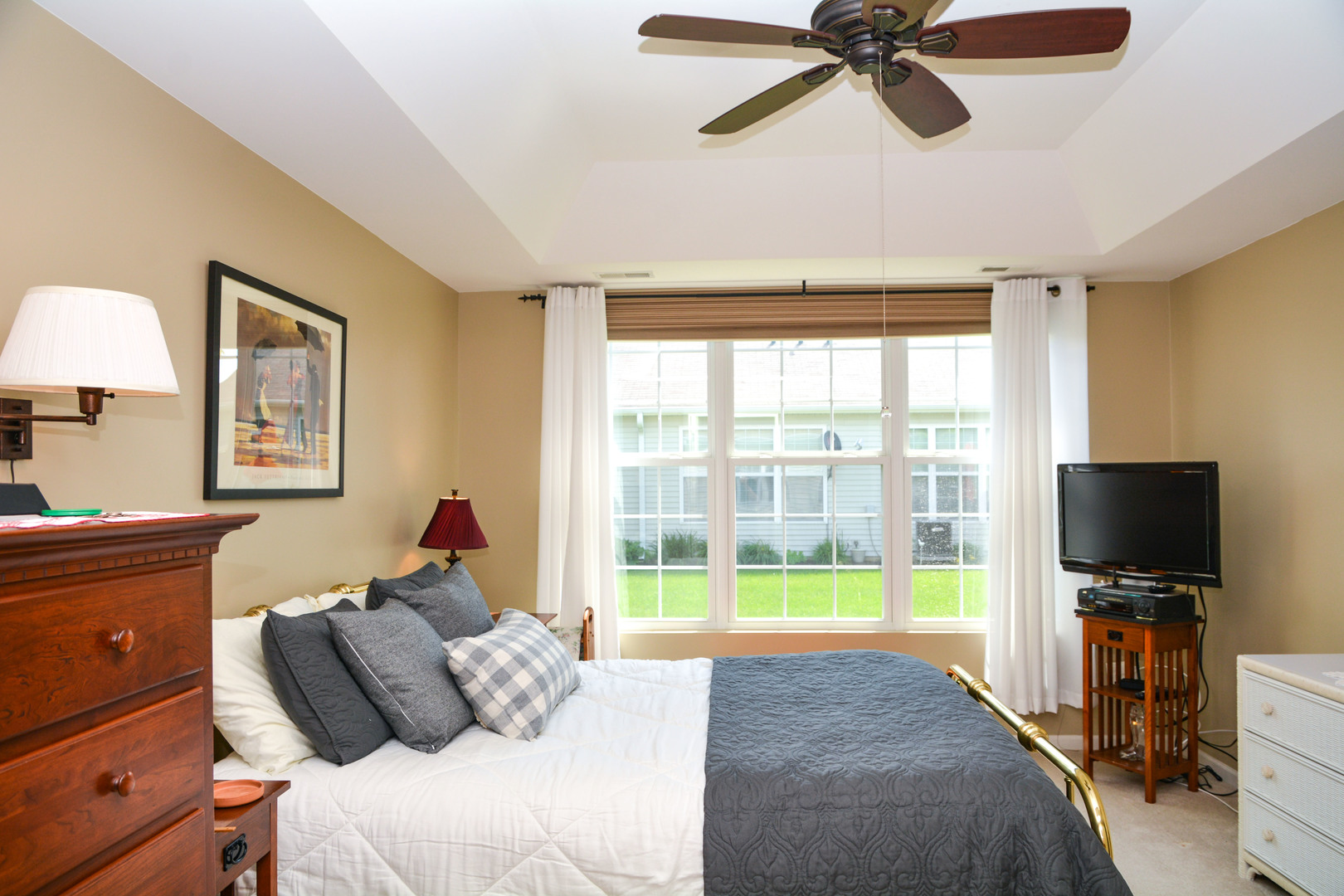 13482 Delaney Road Huntley, IL 60142 - Photo 12 of 18 a bedroom with a bed and a flat screen tv