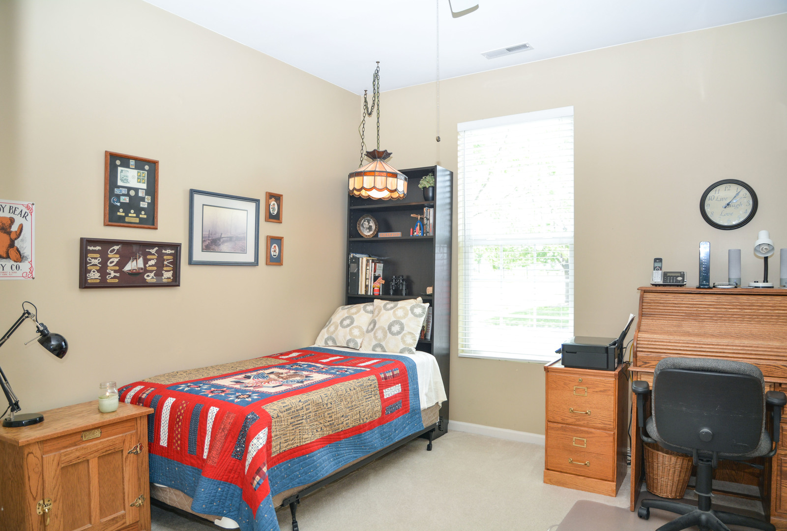 13482 Delaney Road Huntley, IL 60142 - Photo 14 of 18 a bedroom with a bed and a table in it