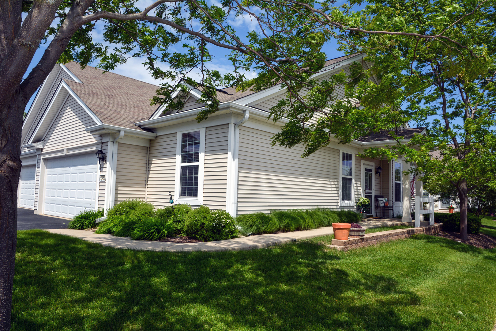 13482 Delaney Road Huntley, IL 60142 - Photo 17 of 18 a house view with a garden space and wooden fence