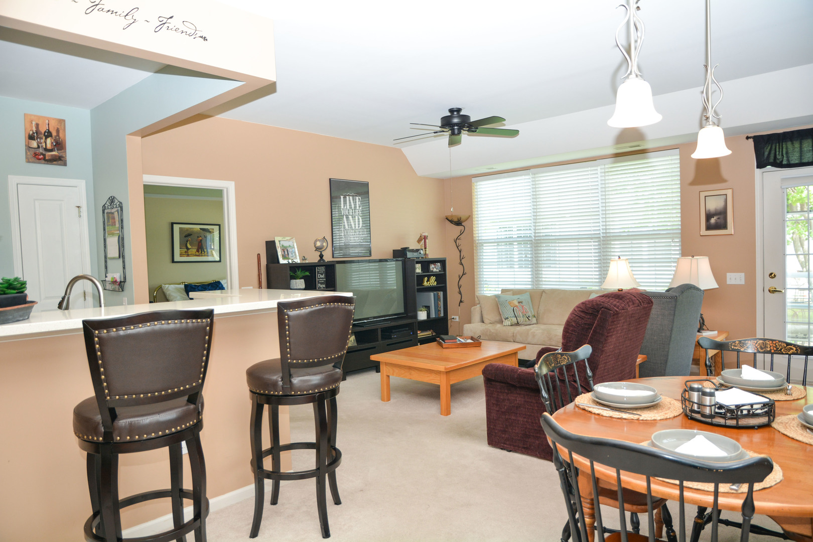 13482 Delaney Road Huntley, IL 60142 - Photo 3 of 18 a dining room with furniture a chandelier and window