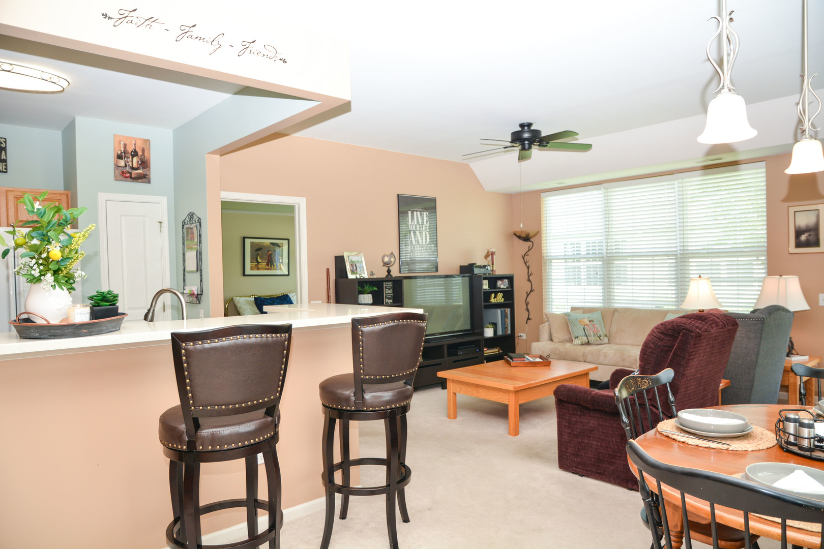 13482 Delaney Road Huntley, IL 60142 - Photo 4 of 18 a dining room with furniture a window and a chandelier