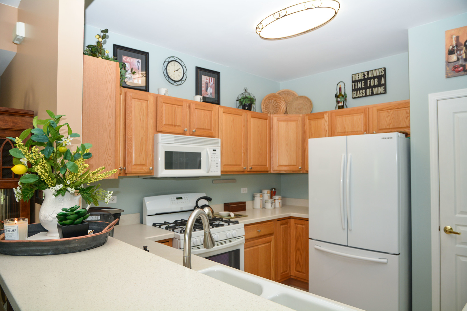 13482 Delaney Road Huntley, IL 60142 - Photo 6 of 18 a kitchen with stainless steel appliances granite countertop a refrigerator and a sink