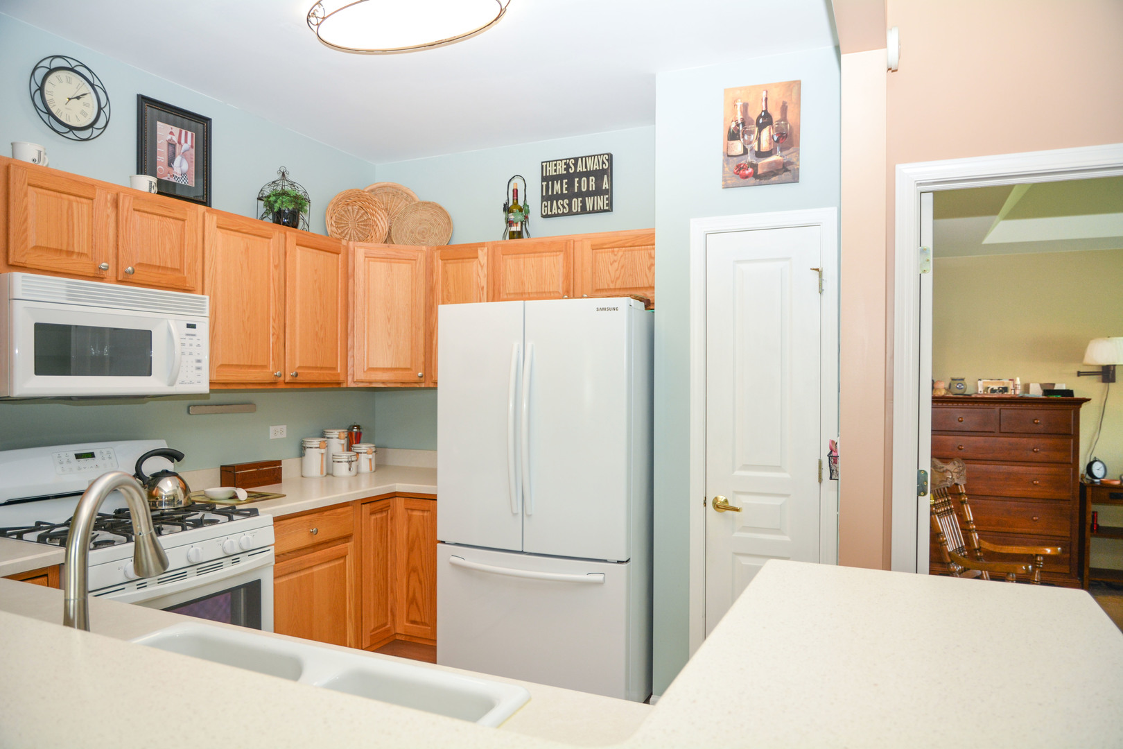 13482 Delaney Road Huntley, IL 60142 - Photo 7 of 18 a kitchen with stainless steel appliances granite countertop a refrigerator and a stove top oven