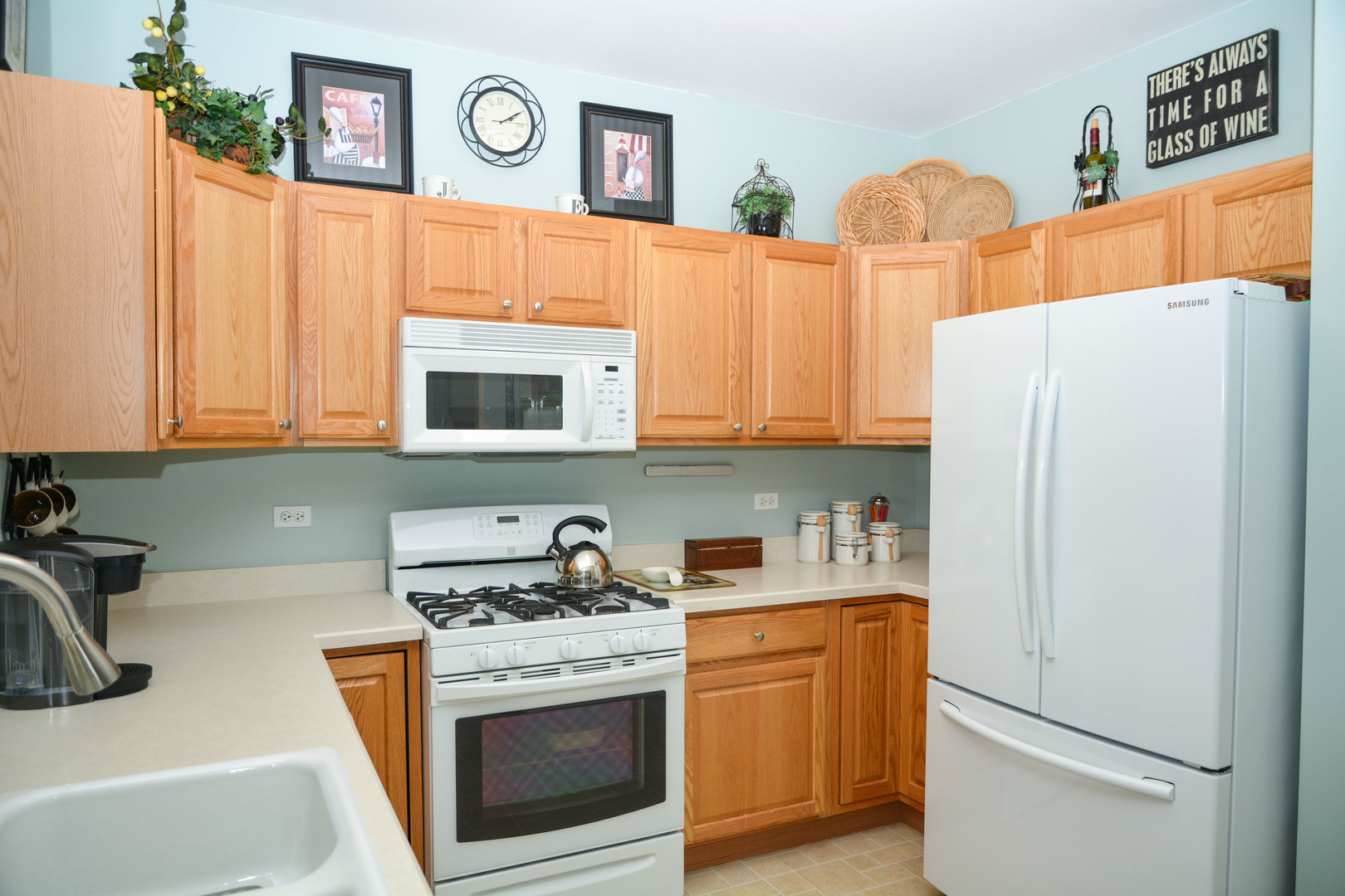 13482 Delaney Road Huntley, IL 60142 - Photo 8 of 18 a kitchen with stainless steel appliances a refrigerator sink and cabinets
