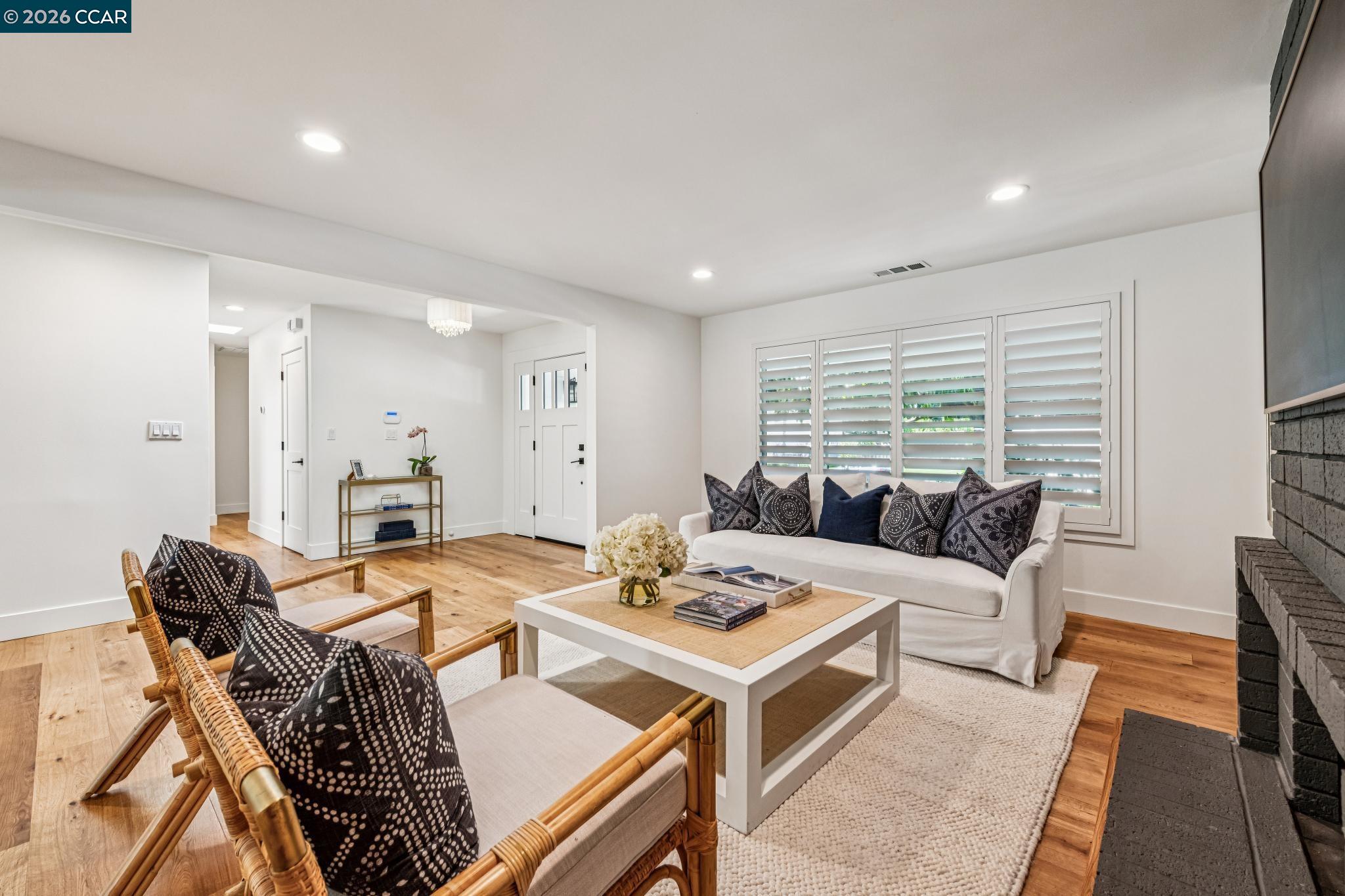2941 Roundhill Road Alamo, CA 94507 - Photo 12 of 83 a living room with furniture and a table