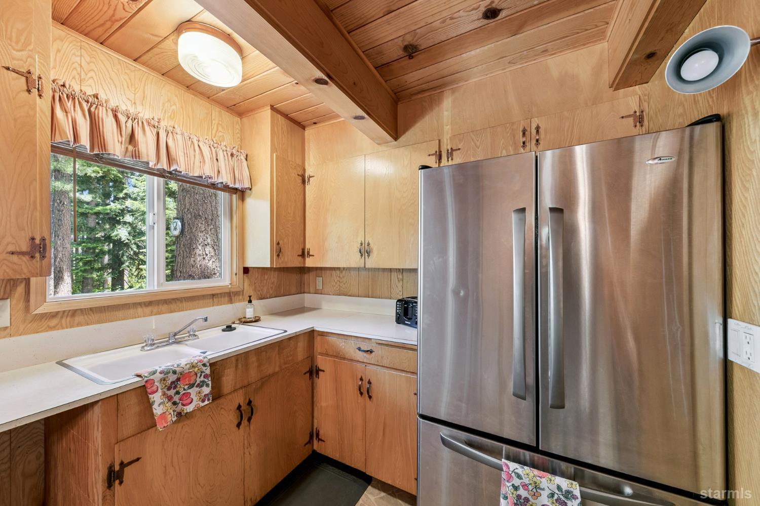 1730 Inca Way South Lake Tahoe, CA 96150 - Photo 11 of 32 a kitchen that has a sink and a window