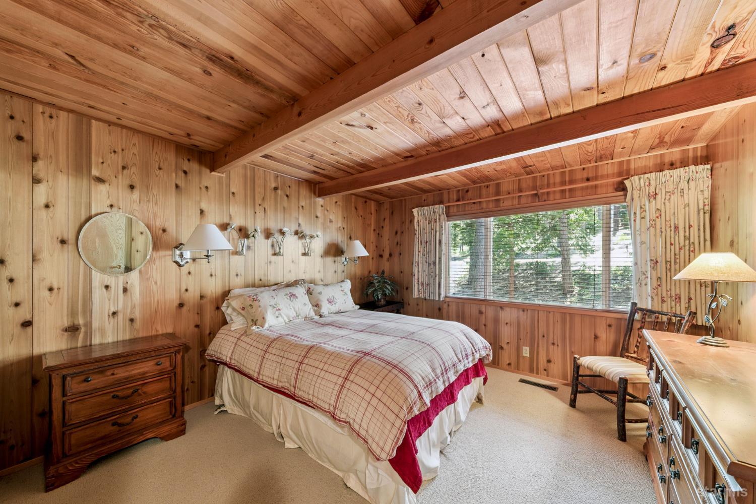 1730 Inca Way South Lake Tahoe, CA 96150 - Photo 14 of 32 a bedroom with a bed mirror and a window