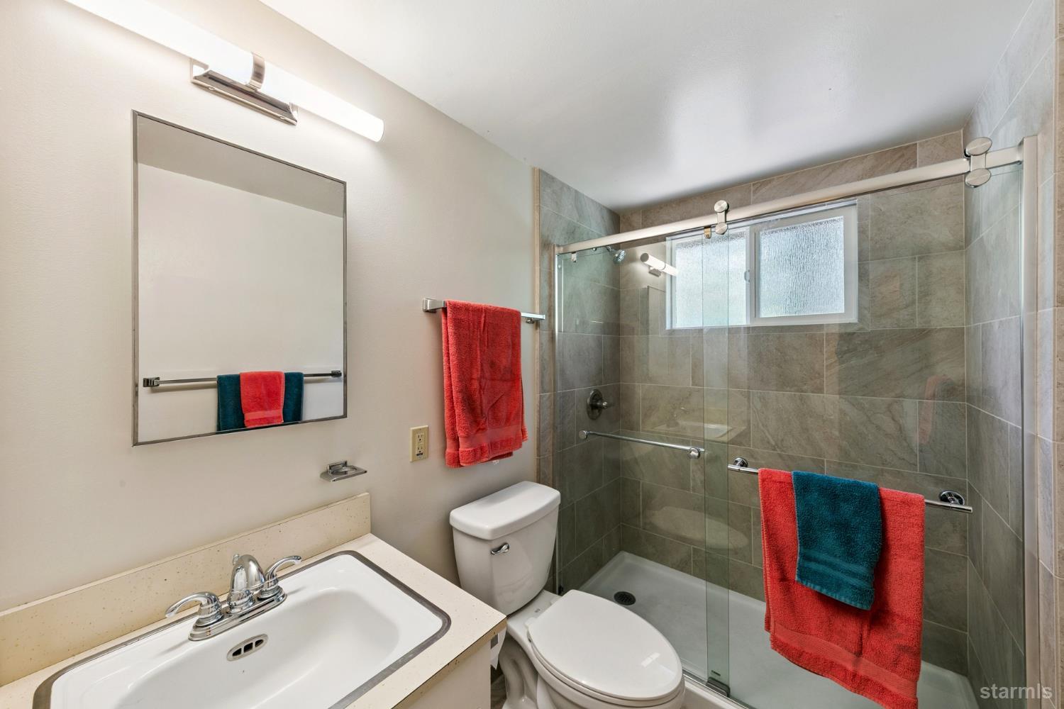 1730 Inca Way South Lake Tahoe, CA 96150 - Photo 15 of 32 a bathroom with a toilet sink and shower