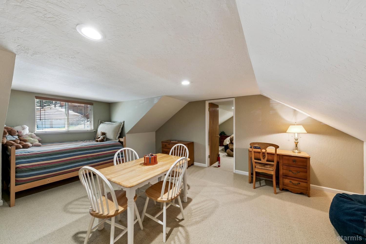 1730 Inca Way South Lake Tahoe, CA 96150 - Photo 16 of 32 a dining room with furniture and a chandelier