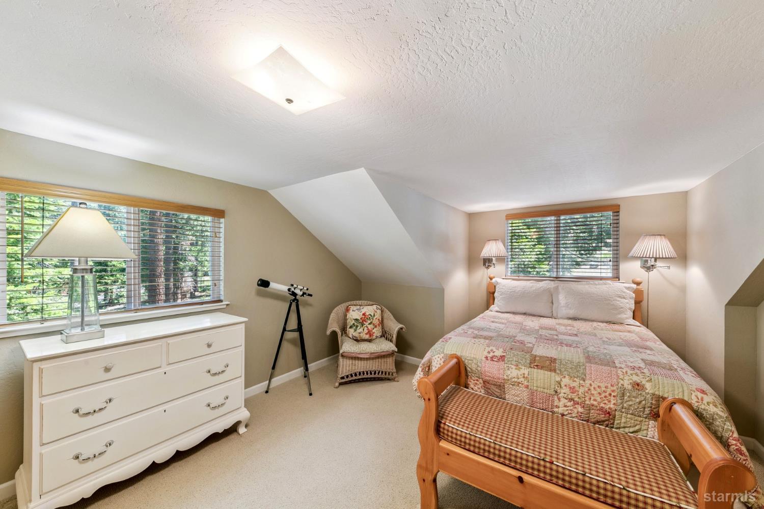 1730 Inca Way South Lake Tahoe, CA 96150 - Photo 17 of 32 a bedroom with a bed and a window dresser