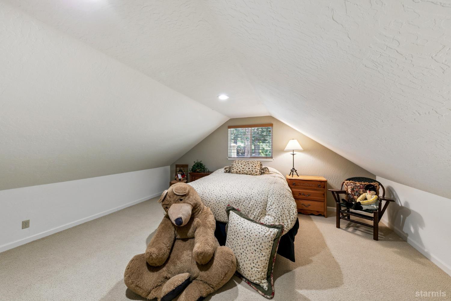 1730 Inca Way South Lake Tahoe, CA 96150 - Photo 18 of 32 a bedroom with a bed and a window