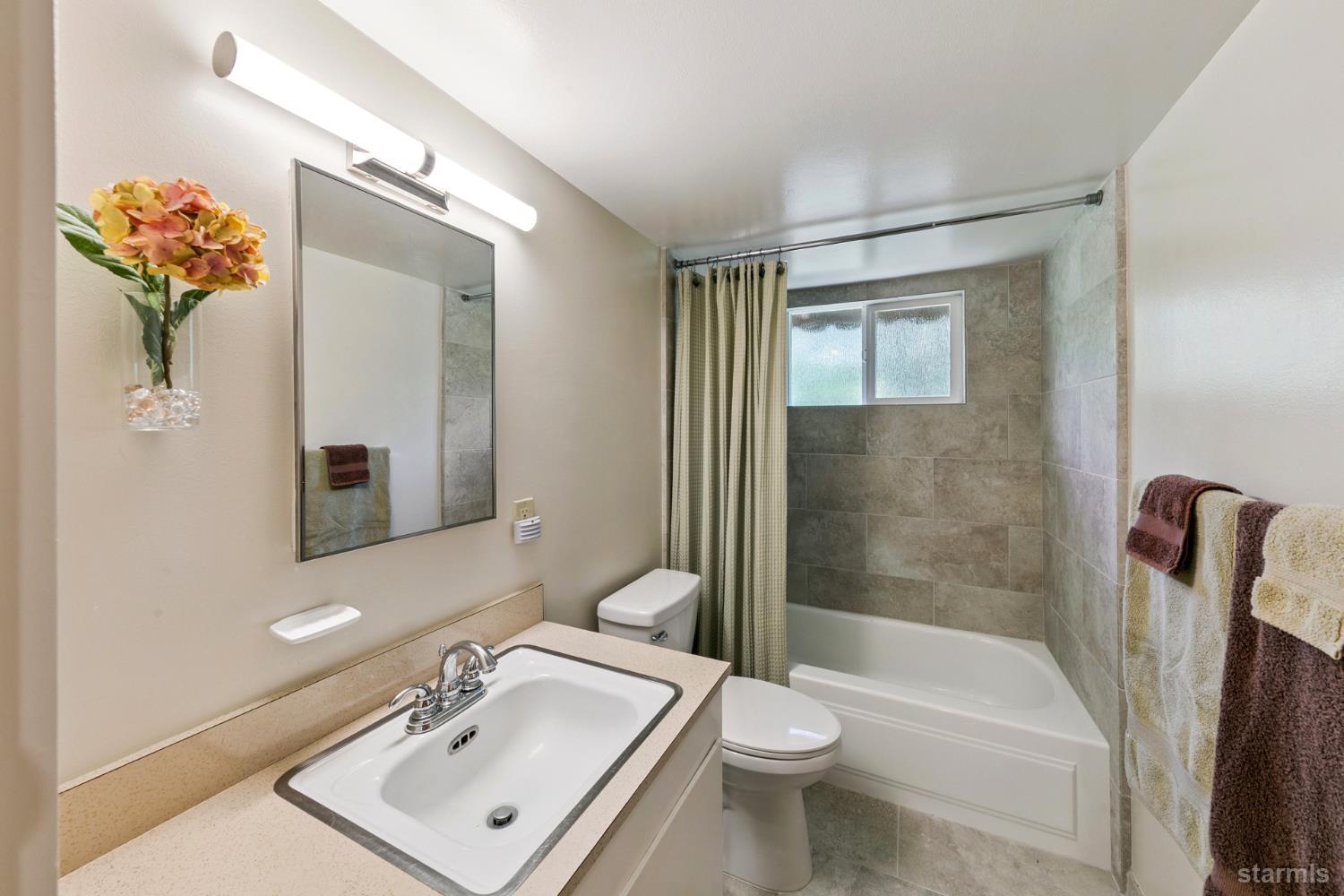 1730 Inca Way South Lake Tahoe, CA 96150 - Photo 19 of 32 a bathroom with a sink toilet and shower